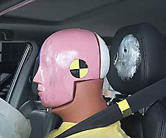 Dummy movement was well controlled. During rebound, the dummy's head hit only the head restraint, as indicated by smeared greasepaint