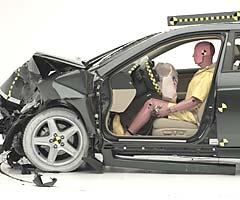 The dummy's position in relation to the steering wheel and instrument panel after the crash test indicates that the driver's survival space was maintained very well