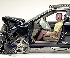 The dummy's position in relation to the steering wheel and instrument panel after the crash test indicates that the driver's survival space was maintained well