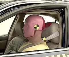 Dummy movement was well controlled. During rebound, the dummy's head hit only the head restraint