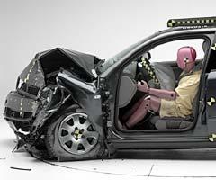 The dummy's position in relation to the steering wheel and instrument panel after the crash test indicates that the driver's survival space was maintained well