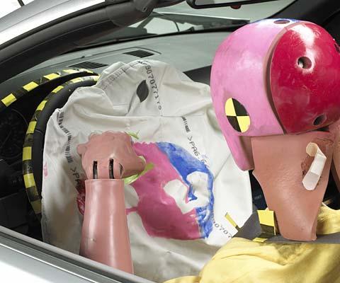 Dummy movement was well controlled. Smeared greasepaint on the airbag indicates the dummy's head contacted it near its center