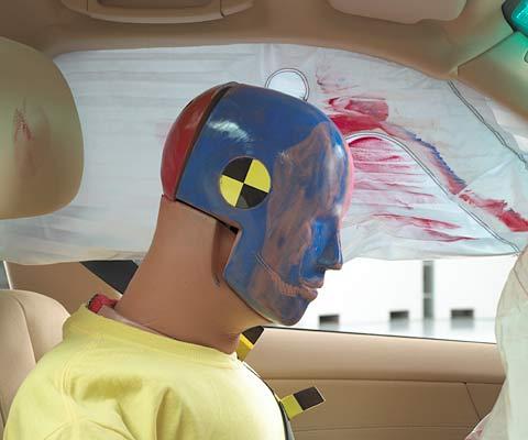 Smeared greasepaint indicates where the dummy's head brushed across the side curtain airbag during rebound