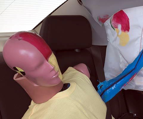 Smeared greasepaint shows where the rear passenger dummy's head was protected by the side airbag.