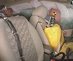 Action shot taken during the side impact crash test showing the driver dummy's head was protected from being hit by hard structures by the side curtain airbag.