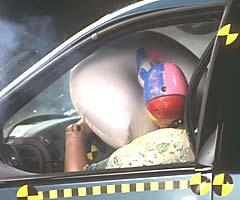 Vertical movement of the steering wheel rotated the dummy's head and neck sharply to the rear