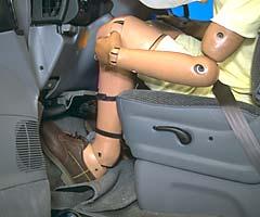 Intrusion of vehicle structure into the footwell area contributed to high forces on both lower legs