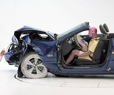 The dummy's position in relation to the steering wheel and instrument panel after the crash test indicates that the driver's survival space was maintained reasonably well