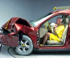 The dummy's position in relation to the steering wheel and instrument panel after the crash test indicates that the driver's survival space was maintained well