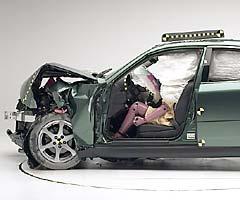 The dummy's position in relation to the steering wheel and instrument panel after the crash test indicates that the driver's survival space was maintained well