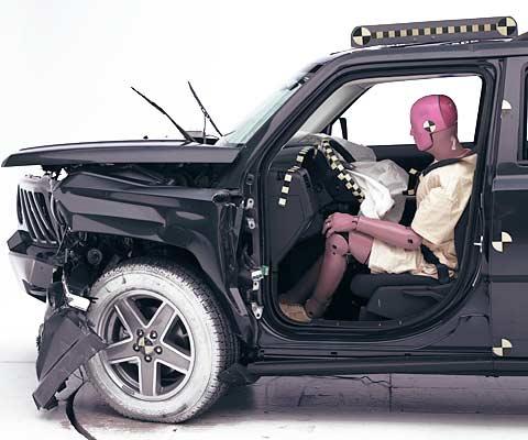 The dummy's position in relation to the steering wheel and instrument panel after the crash test indicates that the driver's survival space was maintained well