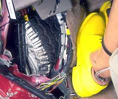 The left front tire intruded into the driver footwell area, producing moderately high forces on the tibia and contributing to the possibility of lower leg and foot injuries