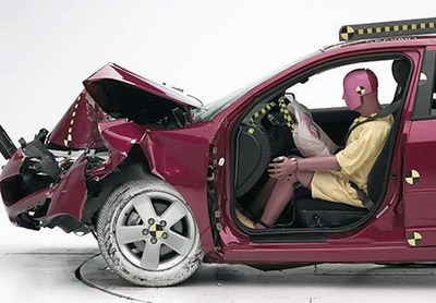 The dummy's position in relation to the steering wheel and instrument panel after the crash test indicates that the driver's survival space was maintained well