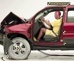 The dummy's position in relation to the steering wheel and instrument panel after the crash test indicates that the driver's survival space was maintained reasonably well