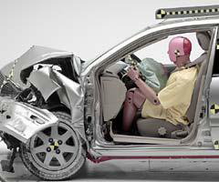 The dummy's position in relation to the steering wheel and instrument panel after the crash test indicates the driver's survival space was maintained well