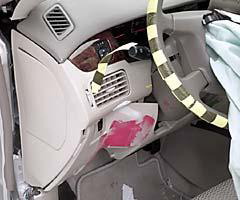 The dummy's left knee and shin pressed into and deformed the knee bolster to the left of the steering column. Leg injury risk was low