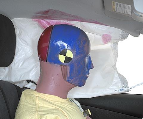 Smeared greasepaint indicates where the dummy's head brushed across the side curtain airbag and dislodged headliner. This airbag did not deploy in the test conducted by Nissan