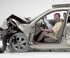 The dummy's position in relation to the steering wheel and instrument panel after the second crash test indicates that the driver's survival space was maintained well