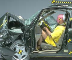 The dummy's position in relation to the steering wheel and instrument panel after the crash test -- plus footwell intrusion -- indicate the driver's survival space wasn't maintained well