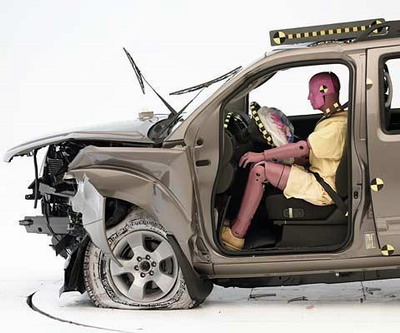 The dummy's position in relation to the steering wheel and instrument panel after the crash test indicates that the driver's survival space was maintained well