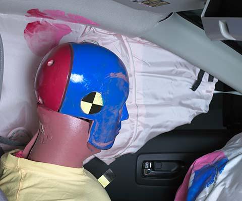 Smeared greasepaint indicates where the dummy's head contacted the side curtain airbag and dislodged headliner during rebound