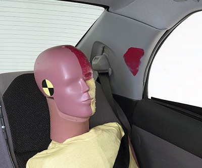 Smeared greasepaint shows where the rear passenger dummy's head was protected by the side airbag.