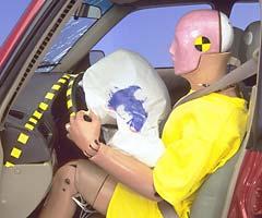 The dummy's position in relation to the steering wheel and instrument panel after the crash test indicates that the driver space was maintained reasonably well