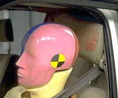 The dummy stayed in position throughout the crash. During rebound, its head hit only the head restraint