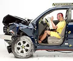 The dummy's position in relation to the steering wheel and instrument panel after the crash test indicates that the driver's survival space was maintained welll