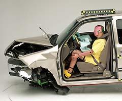 The dummy's position in relation to the steering wheel and instrument panel after the crash test indicates that the driver's survival space was maintained well