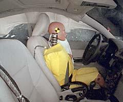 Action shot taken during the side impact crash test showing the driver dummy's head was protected from being hit by hard structures by the side airbags