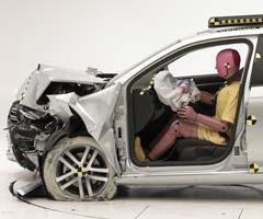 The dummy's position in relation to the steering wheel and instrument panel after the crash test indicates that the driver's survival space was maintained well