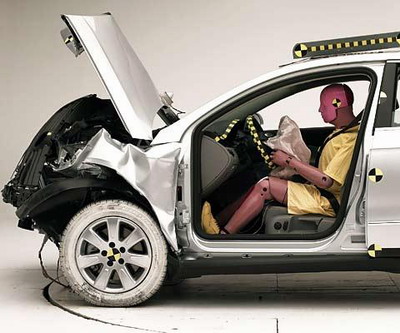 The dummy's position in relation to the steering wheel and instrument panel after the crash test indicates that the driver's survival space was maintained well